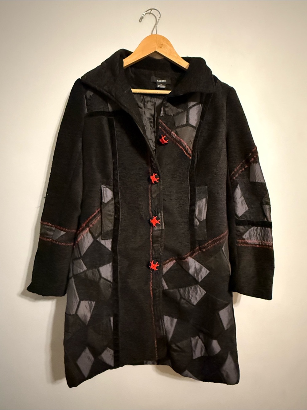 Black Patchwork Coat with Red Button Accents